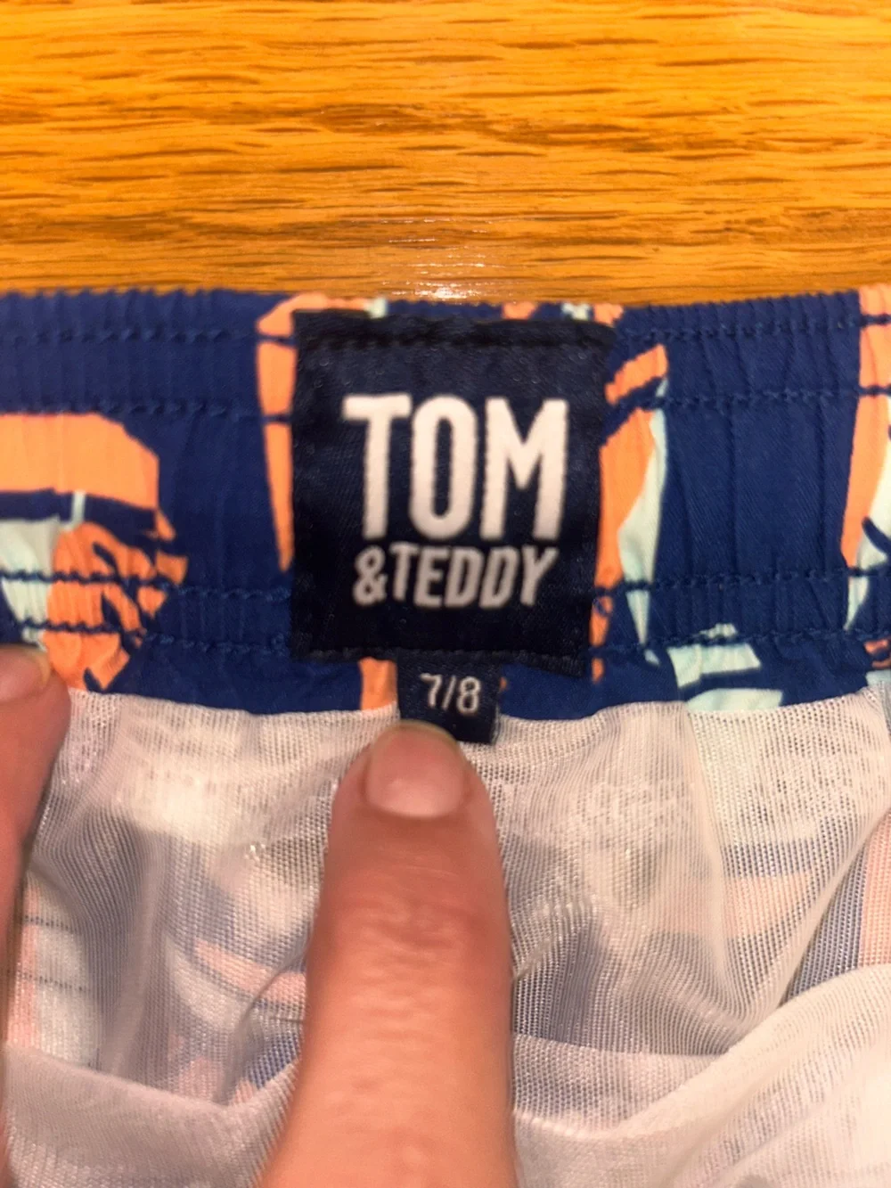 Boys Tom & Teddy Navy Swim Trunks with Coral and Light Blue Sailboat Motif